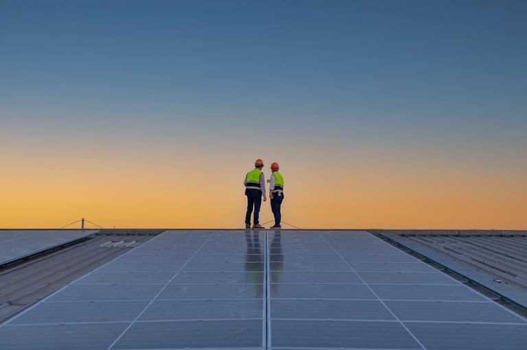 Engineers walking on roof inspect and check solar cell panel by hold equipment box and radio communication, solar cell is smart grid ecology energy sunlight alternative power factory concept.